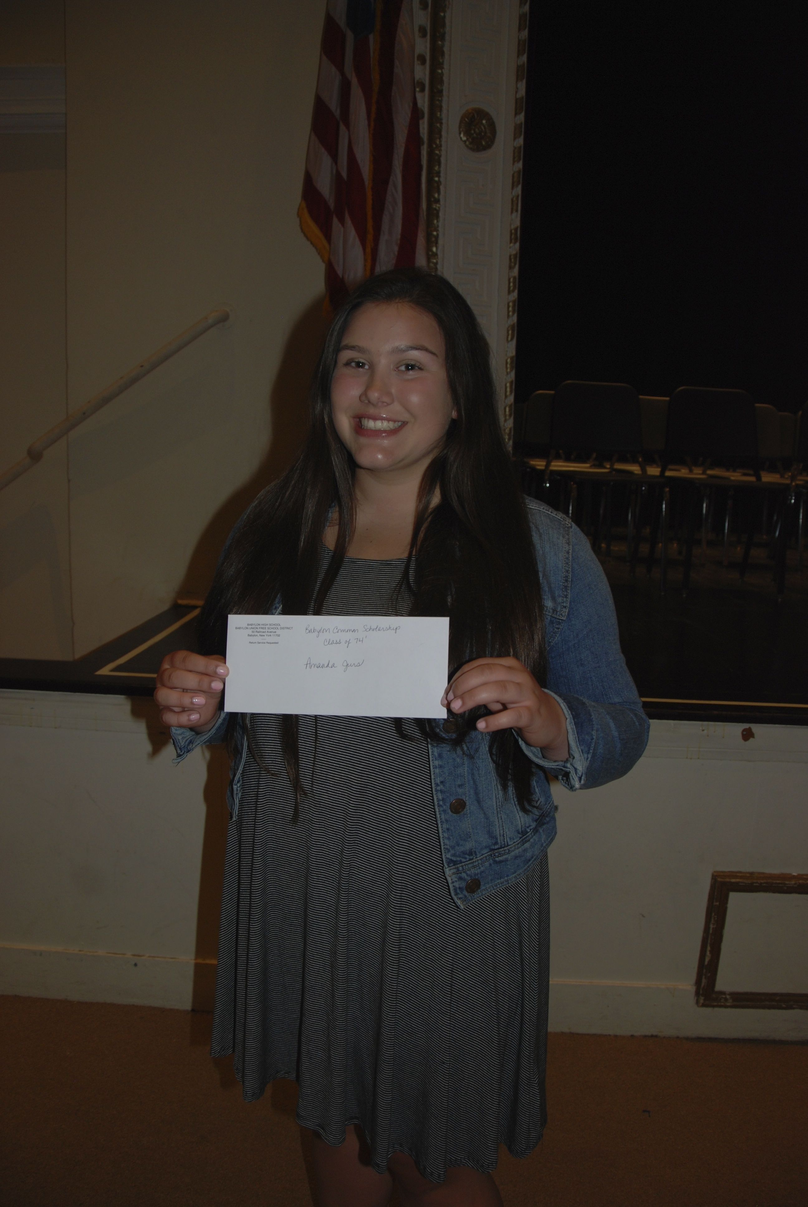 Amanda Jurs receives $1000 scholarship check.